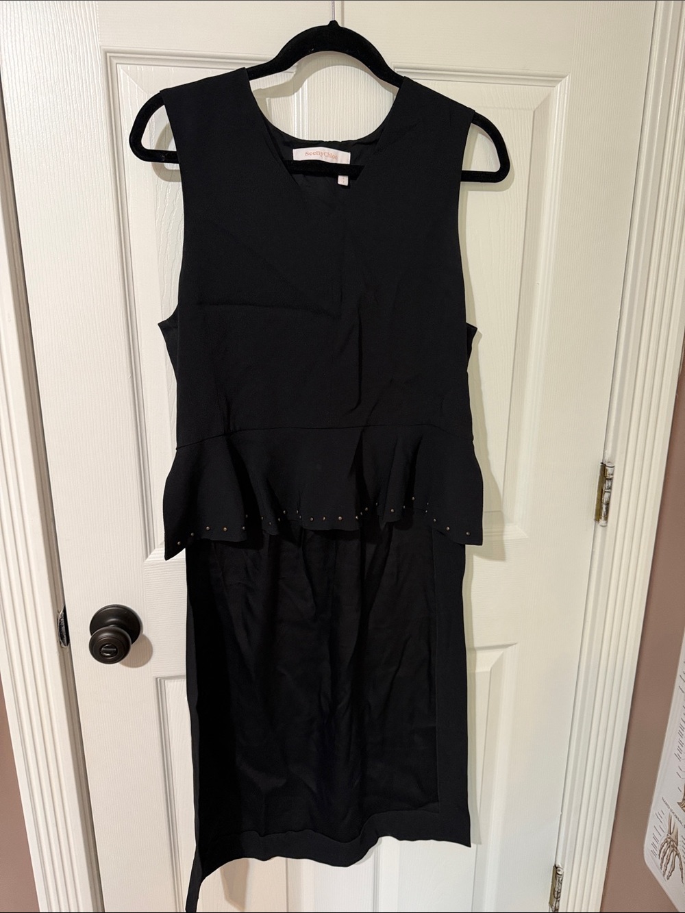Sleeveless Black Peplum Hi-low top